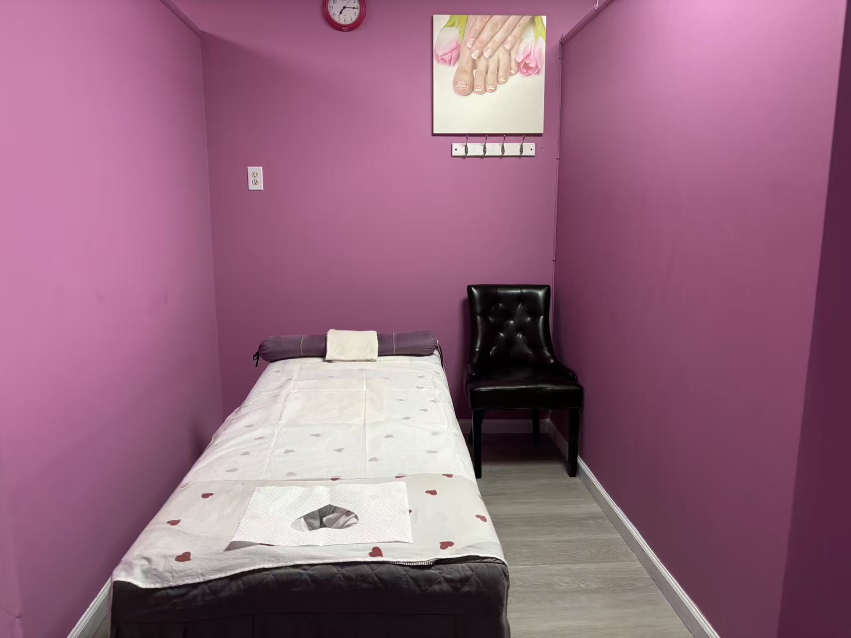 Private treatment room with a freshly prepared massage table
